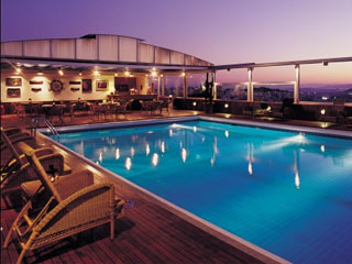 Divani Caravel Pool at Night